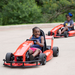 two kids playing with go-karts